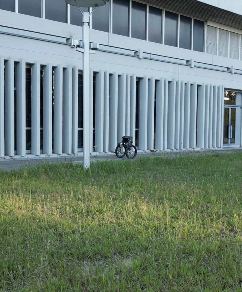 Robot security guard explores the perimeter of a large warehouse and office building
